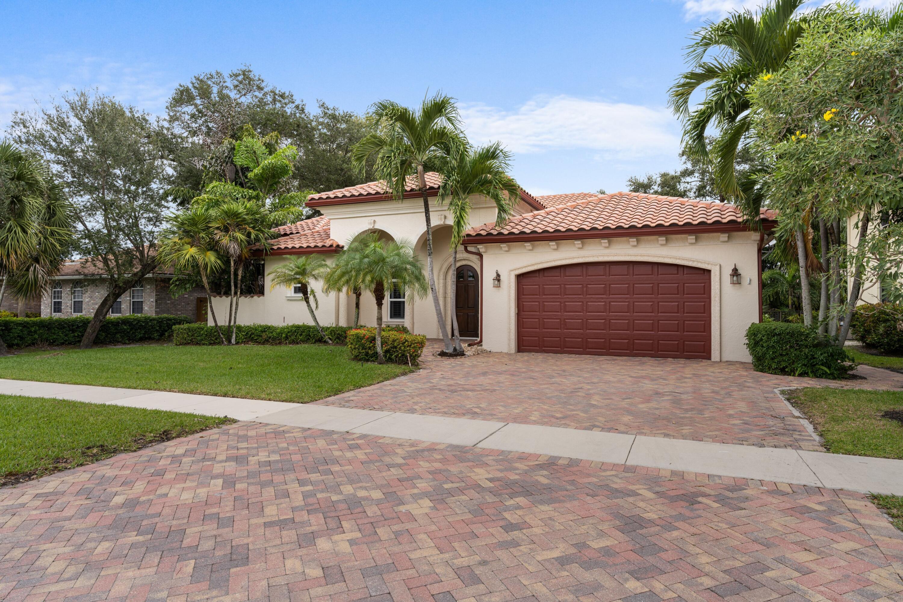 1321 Southwest 16th Street Boca Raton, FL 33486 - Photo 7 of 37 Extra wide brick paved driveway