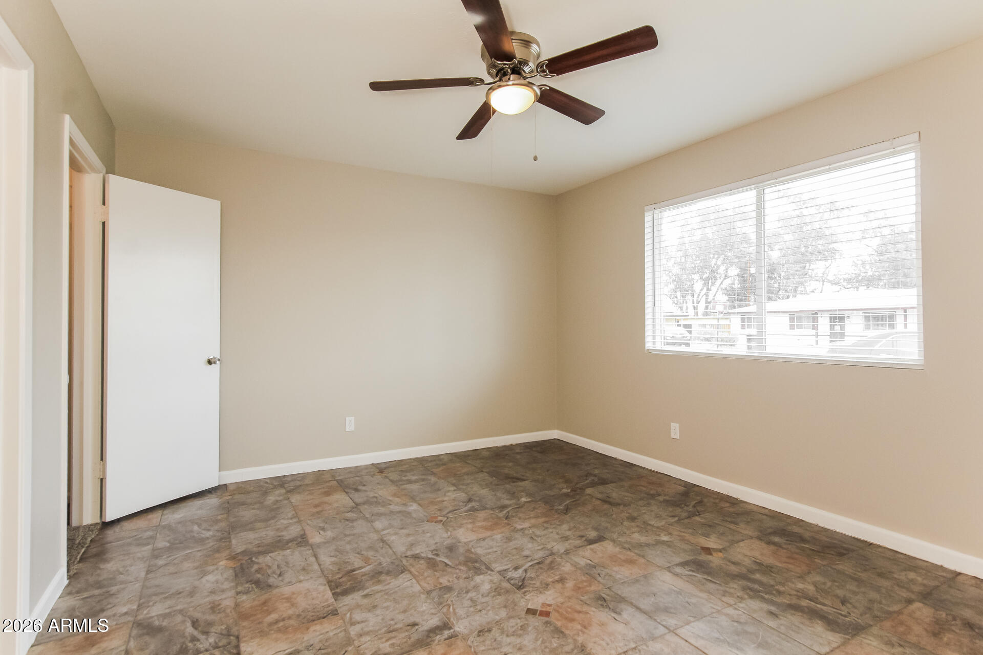 3650 West Berridge Lane Phoenix, AZ 85019 - Photo 11 of 21 a view of an empty room with a window