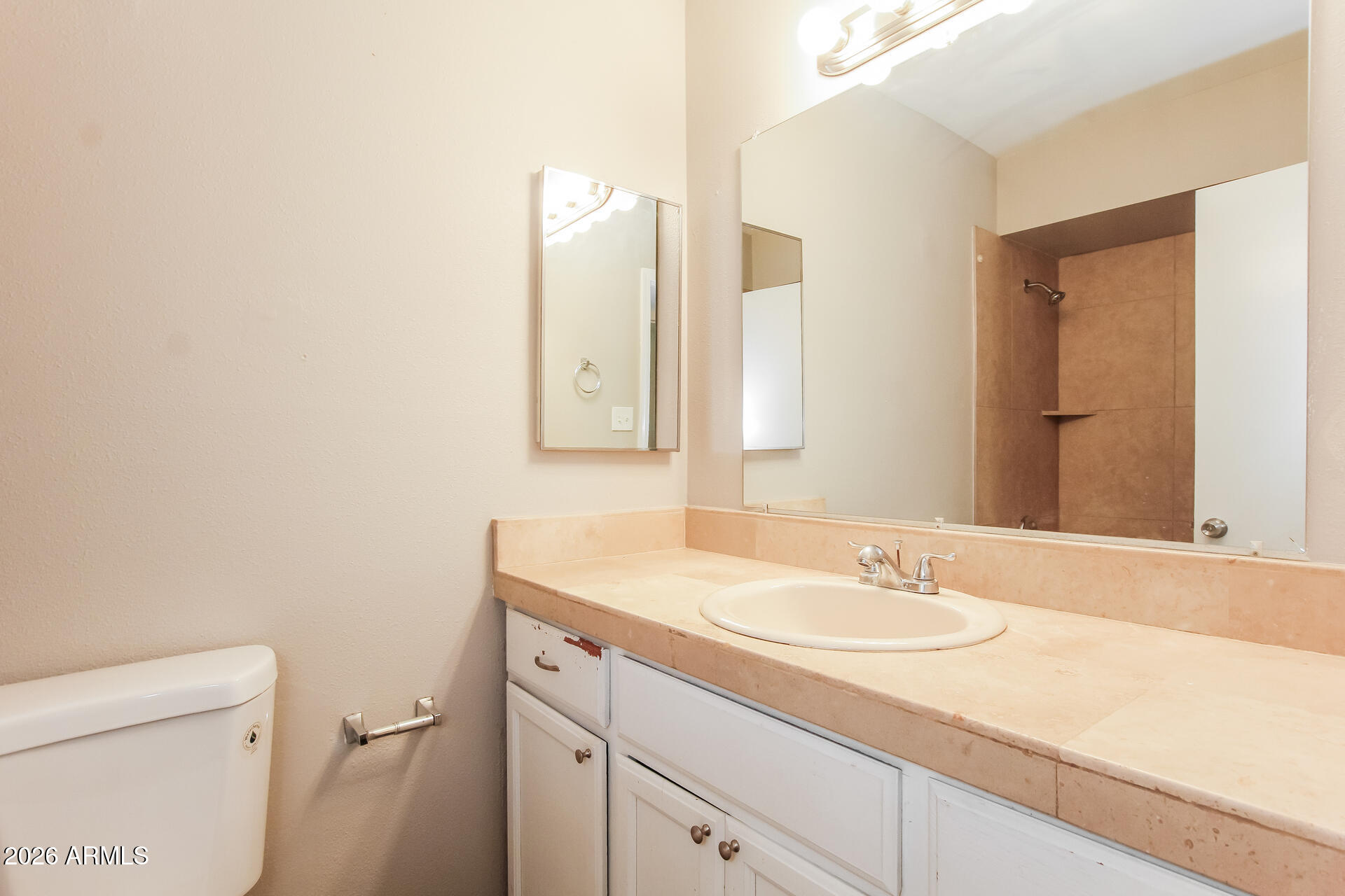 3650 West Berridge Lane Phoenix, AZ 85019 - Photo 13 of 21 a bathroom with a sink and a mirror