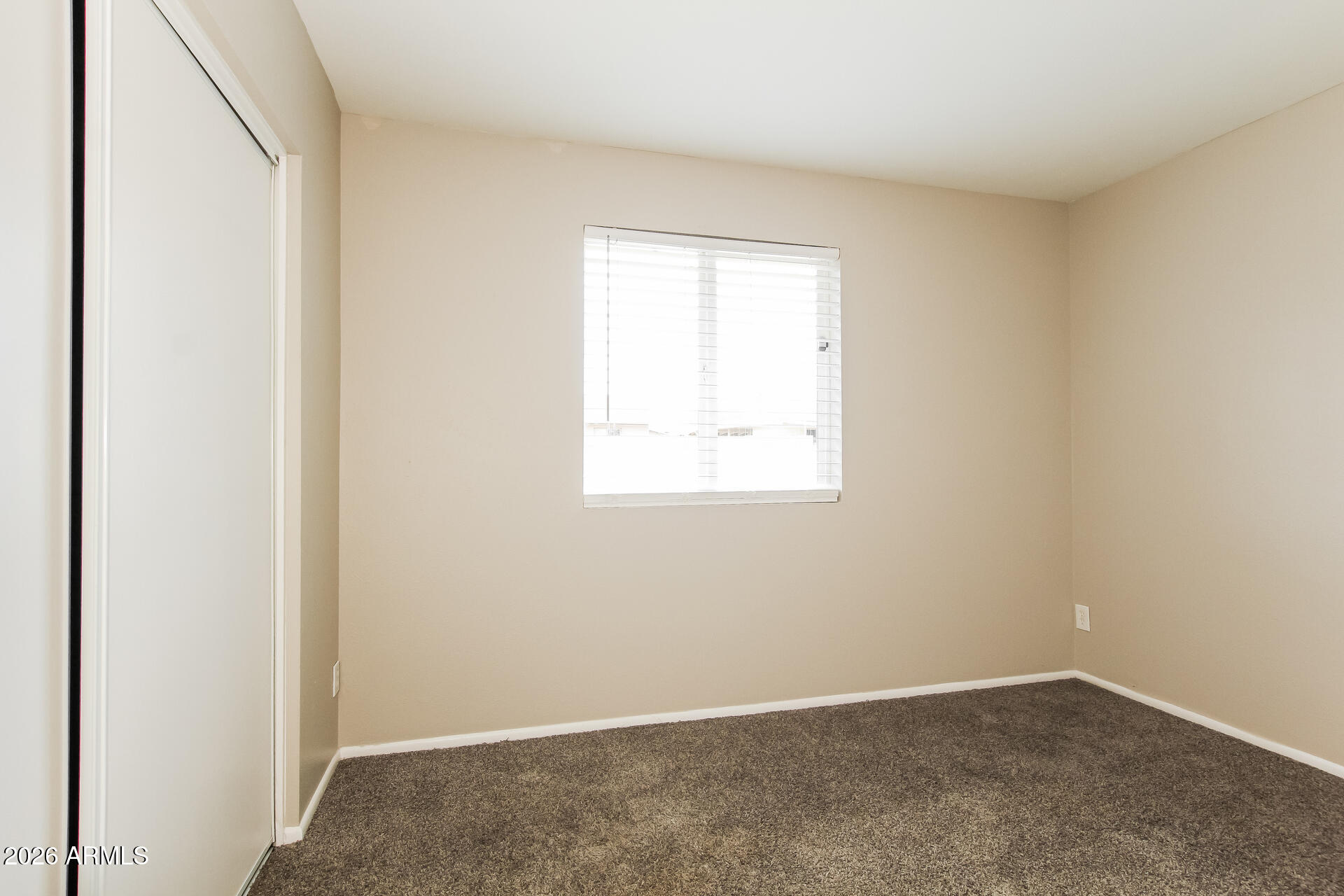 3650 West Berridge Lane Phoenix, AZ 85019 - Photo 15 of 21 an empty room with a window