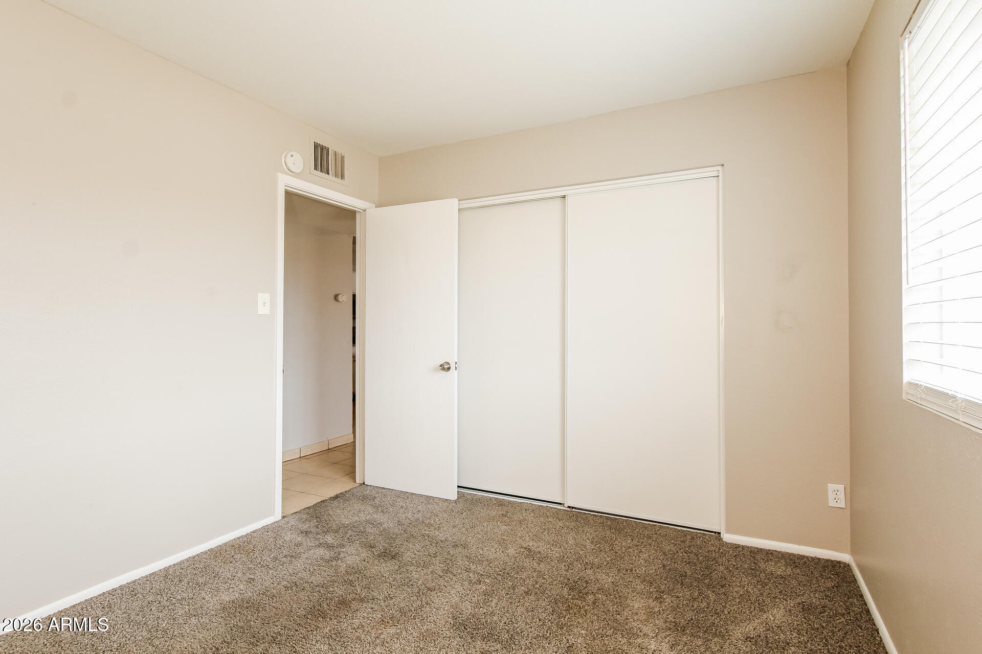 3650 West Berridge Lane Phoenix, AZ 85019 - Photo 16 of 21 a view of an empty room and a window
