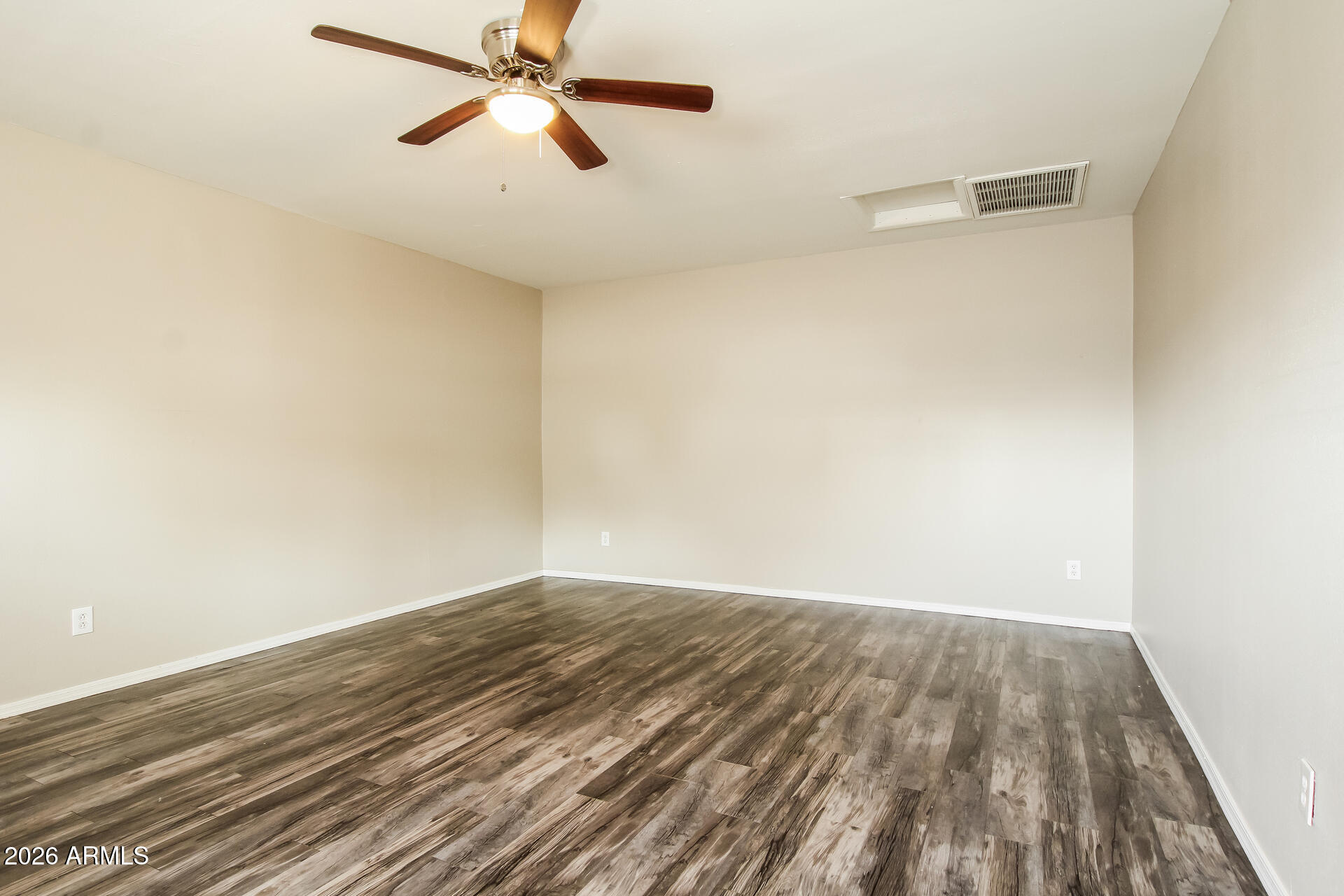 3650 West Berridge Lane Phoenix, AZ 85019 - Photo 18 of 21 a view of empty room with wooden floor