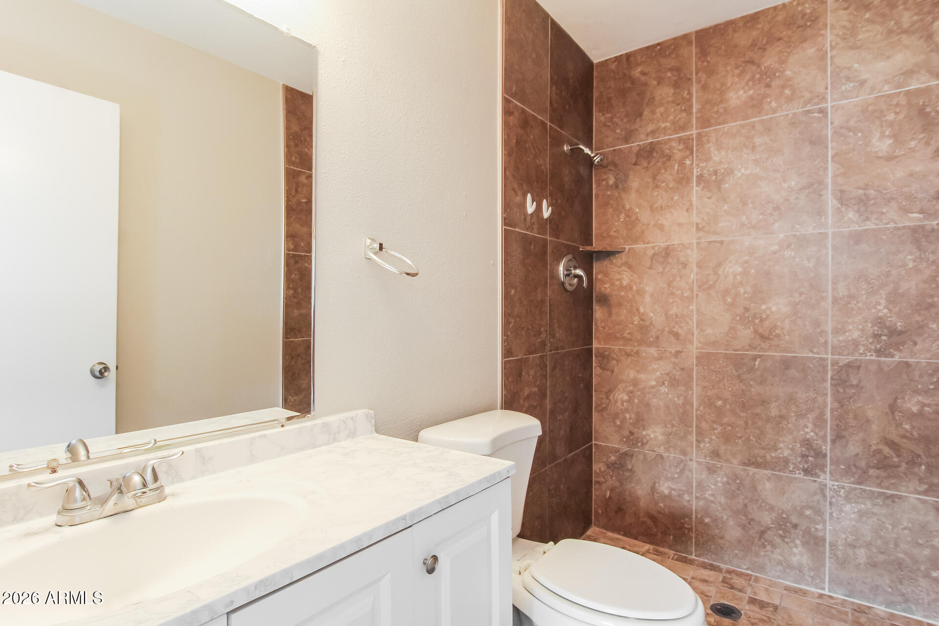 3650 West Berridge Lane Phoenix, AZ 85019 - Photo 19 of 21 a bathroom with a sink a toilet and shower