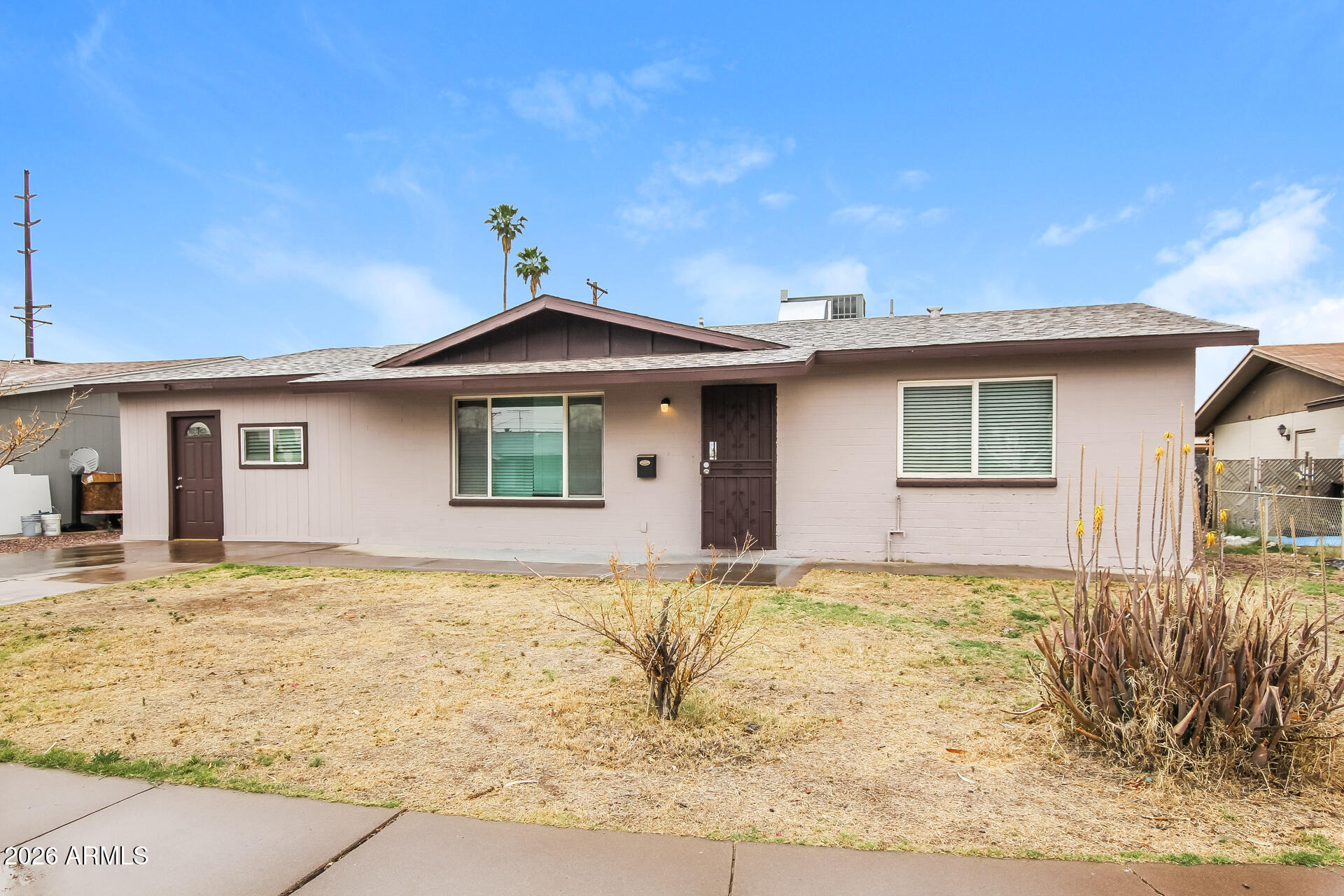 3650 West Berridge Lane Phoenix, AZ 85019 - Photo 2 of 21 a house with yard in front of it