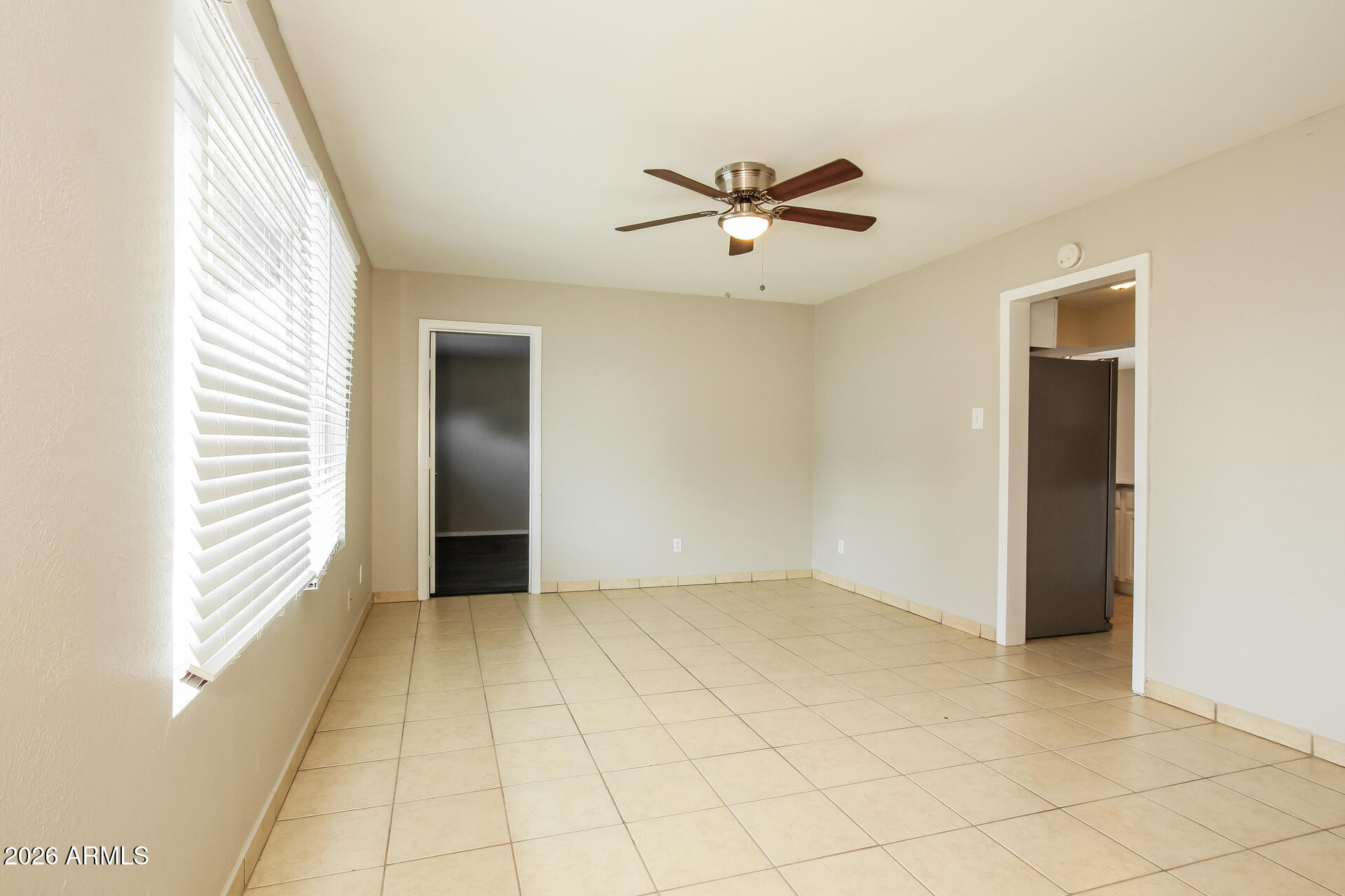 3650 West Berridge Lane Phoenix, AZ 85019 - Photo 5 of 21 a view of an empty room and window