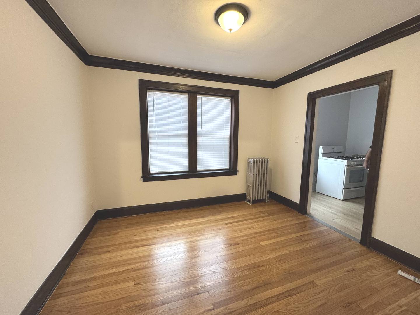 4428 North Laporte Avenue, Unit 2A Chicago, IL 60630 - Photo 15 of 22 an empty room with wooden floor and windows