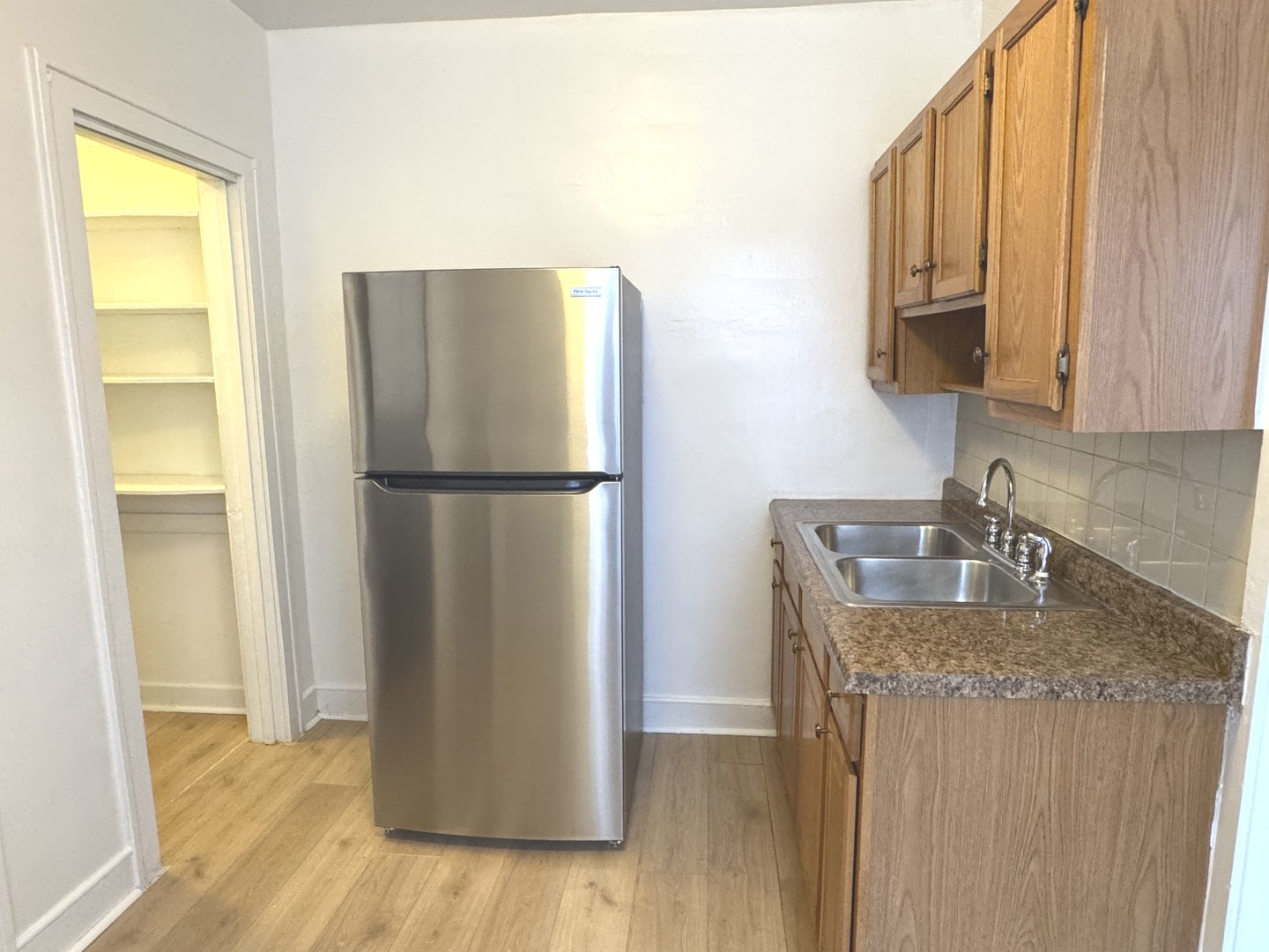 4428 North Laporte Avenue, Unit 2A Chicago, IL 60630 - Photo 18 of 22 a kitchen with refrigerator and window