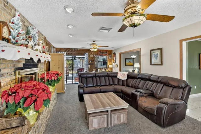 a living room with furniture and flowers