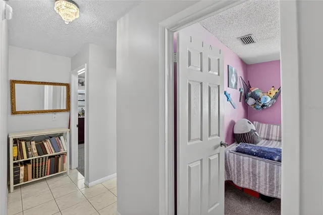 a bedroom with furniture and wooden floor