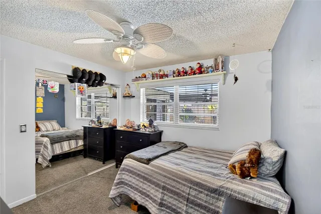 a bedroom with bed and window