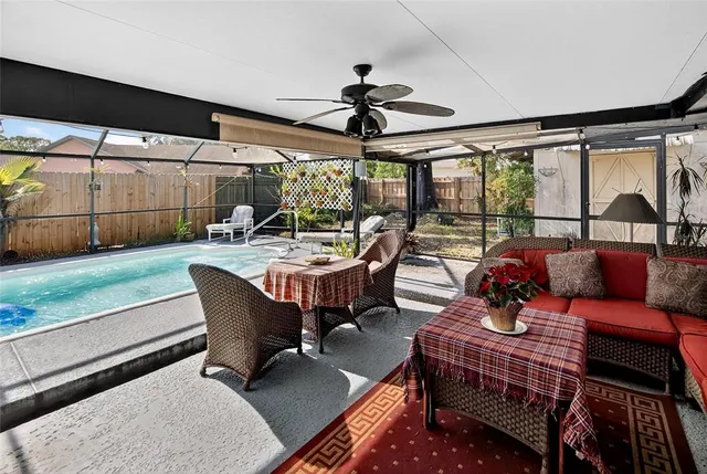 a dining room with furniture a rug and a large window