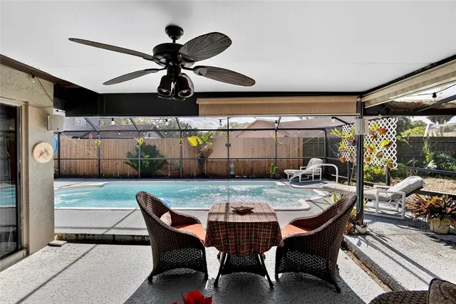 a view of a patio with table and chairs