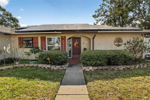 a front view of house with yard