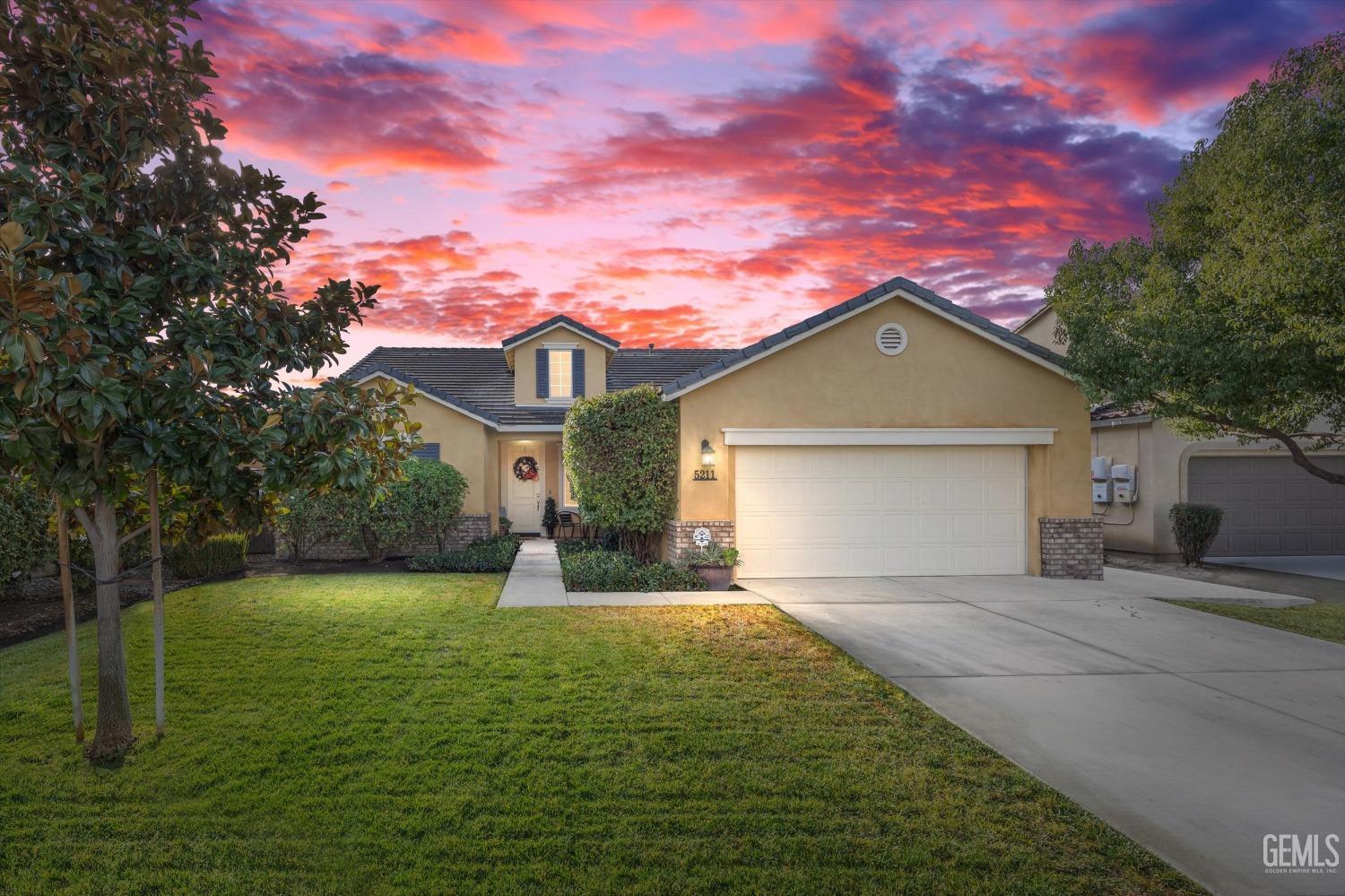 Undisclosed Address Bakersfield, CA 93313 - Photo 1 of 27 a front view of a house with yard and green space
