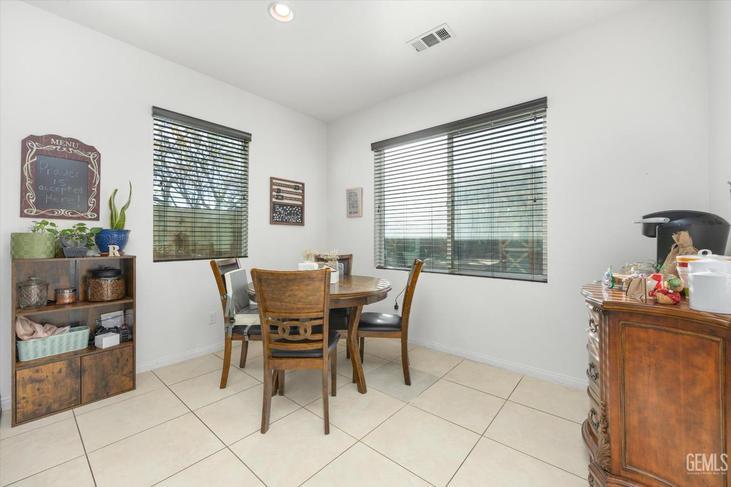 Undisclosed Address Bakersfield, CA 93313 - Photo 12 of 27 a dining room with furniture and window