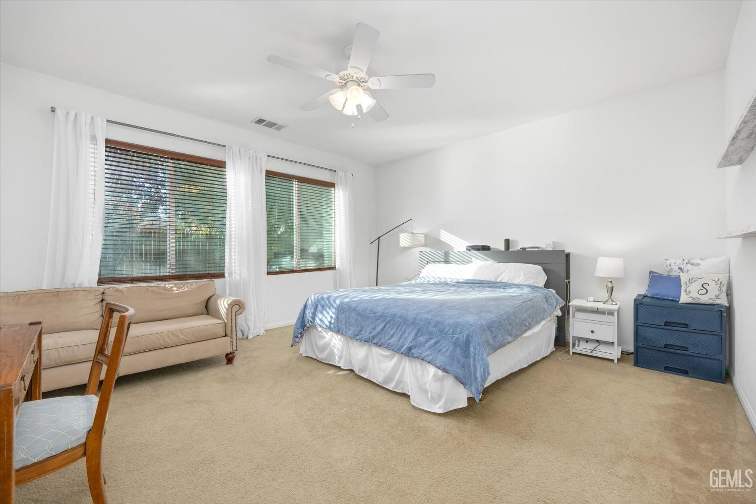 Undisclosed Address Bakersfield, CA 93313 - Photo 16 of 27 a bedroom with a bed and a couch