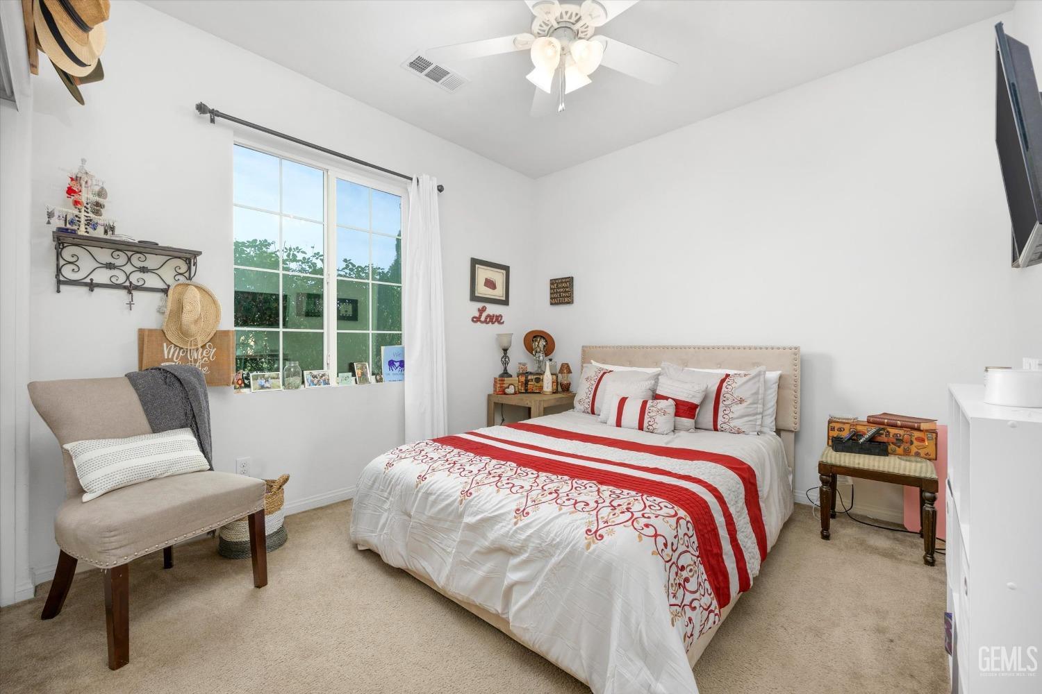 Undisclosed Address Bakersfield, CA 93313 - Photo 19 of 27 a bed room with a bed and a chair