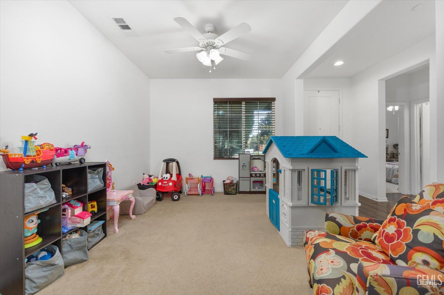Undisclosed Address Bakersfield, CA 93313 - Photo 22 of 27 a bedroom with furniture and a chandelier