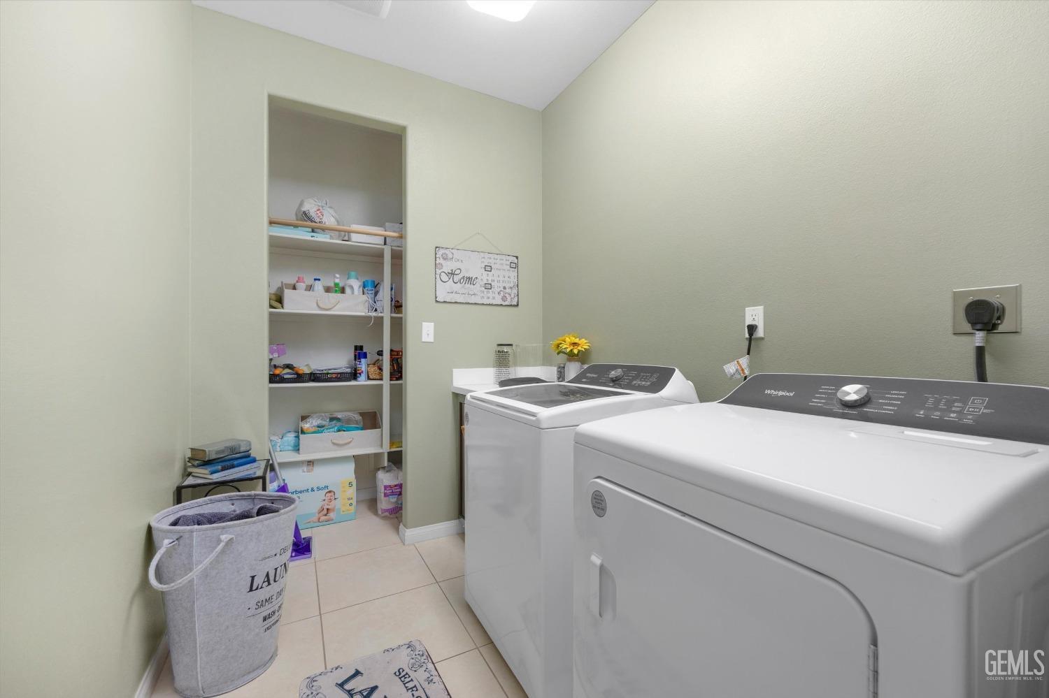 Undisclosed Address Bakersfield, CA 93313 - Photo 23 of 27 a storage room with washer and dryer