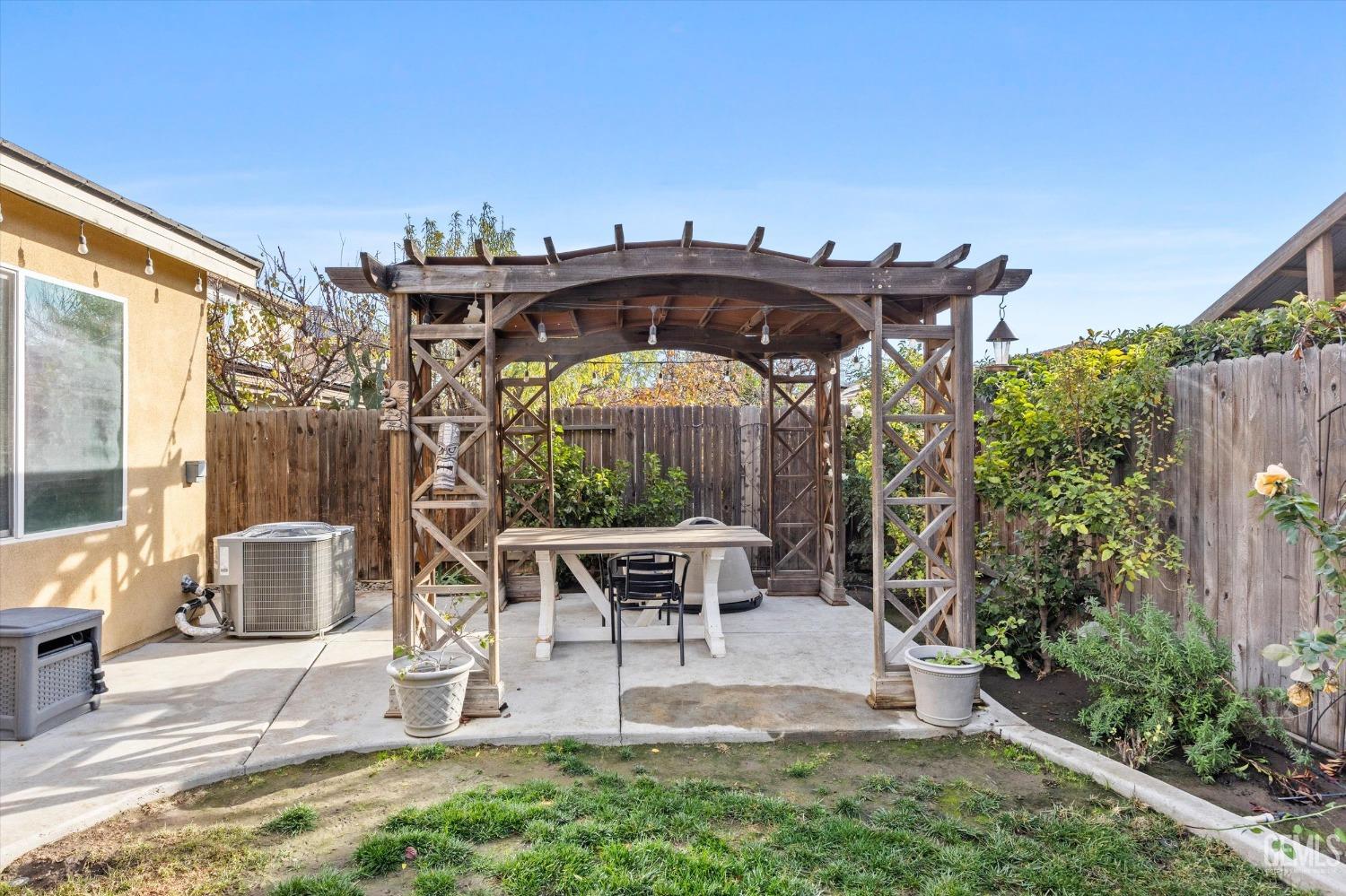 Undisclosed Address Bakersfield, CA 93313 - Photo 25 of 27 a view of a porch with furniture and a yard