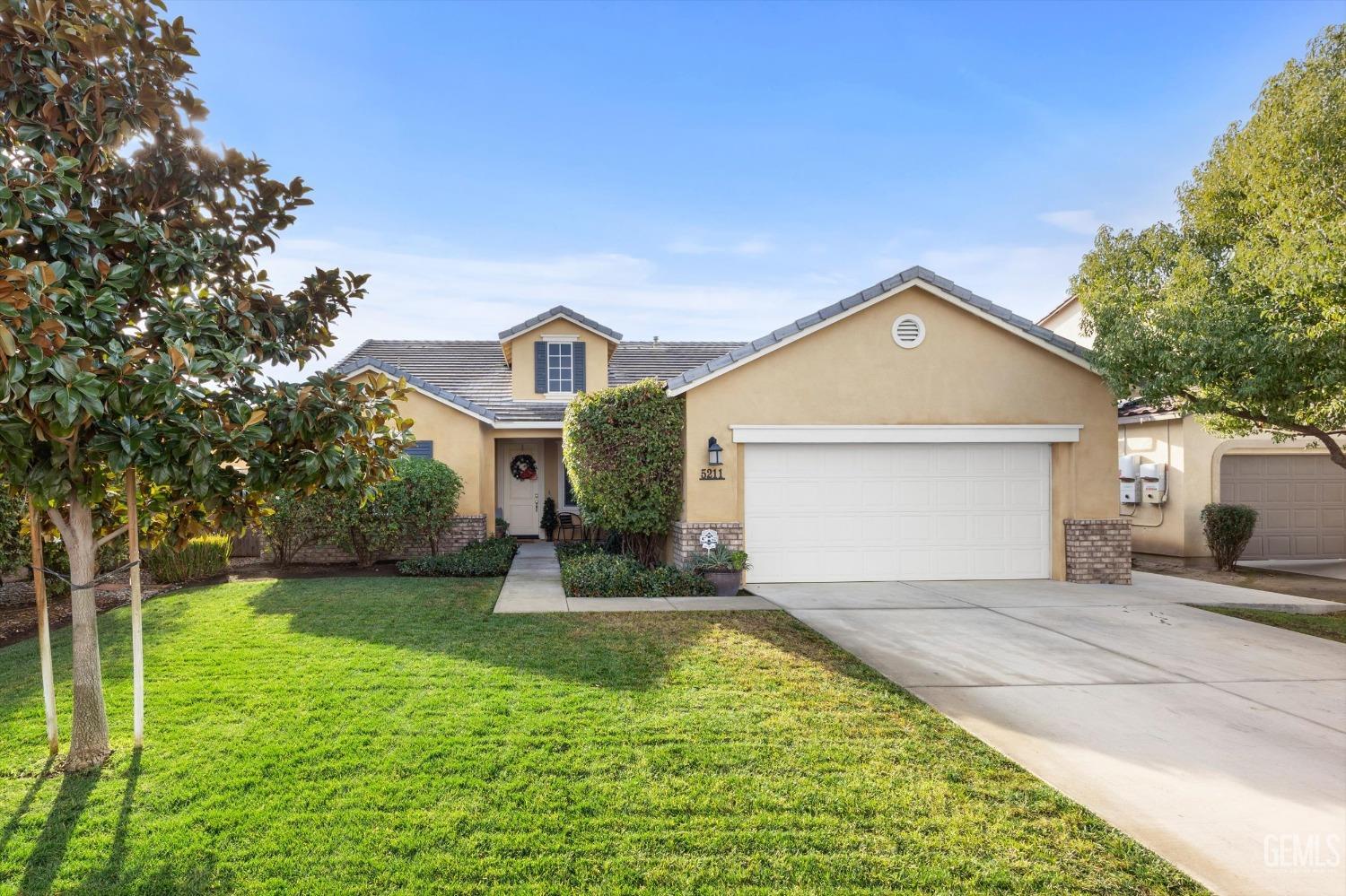 Undisclosed Address Bakersfield, CA 93313 - Photo 3 of 27 a front view of a house with garden
