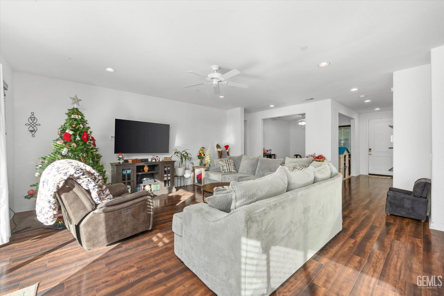 Undisclosed Address Bakersfield, CA 93313 - Photo 10 of 27 a living room with furniture and a flat screen tv