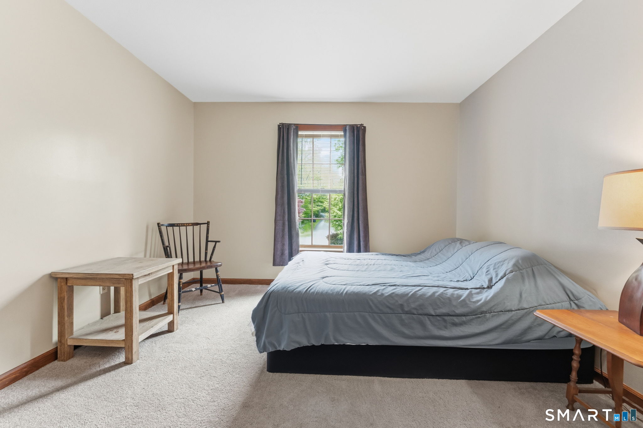 287 South Bear Hill Road Chaplin, CT 06235 - Photo 26 of 37 a bedroom with a bed a table and chair