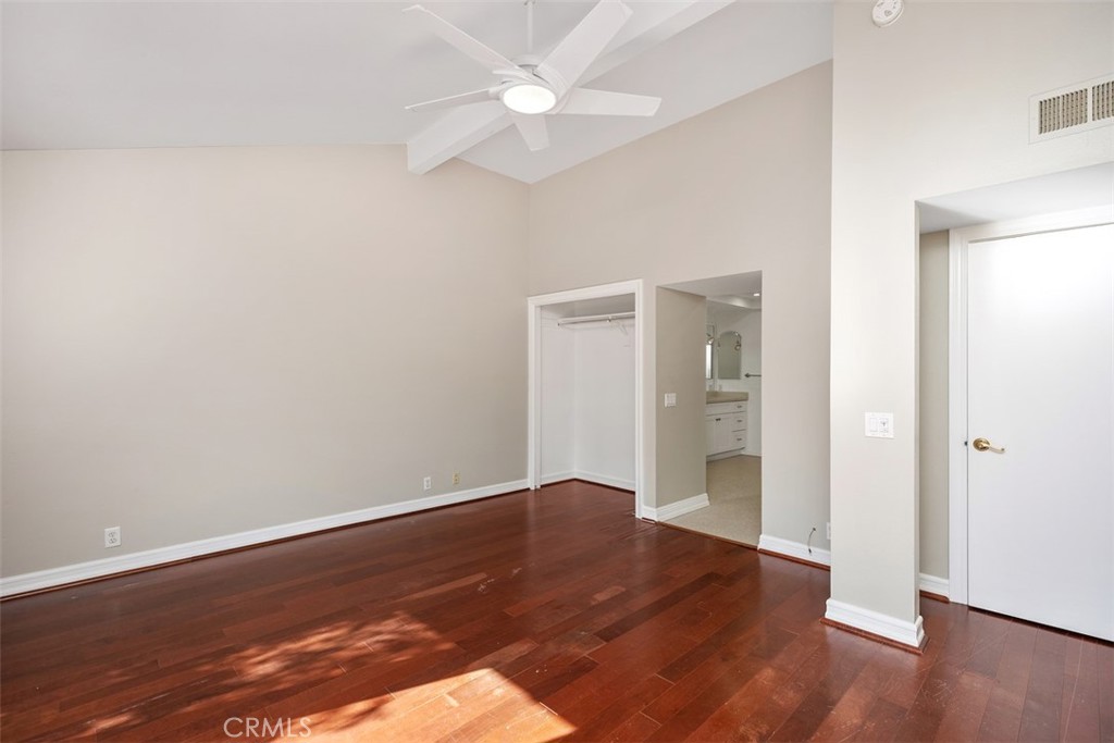 10 Rippling Streme Irvine, CA 92603 - Photo 22 of 31 an empty room with wooden floor and a ceiling fan