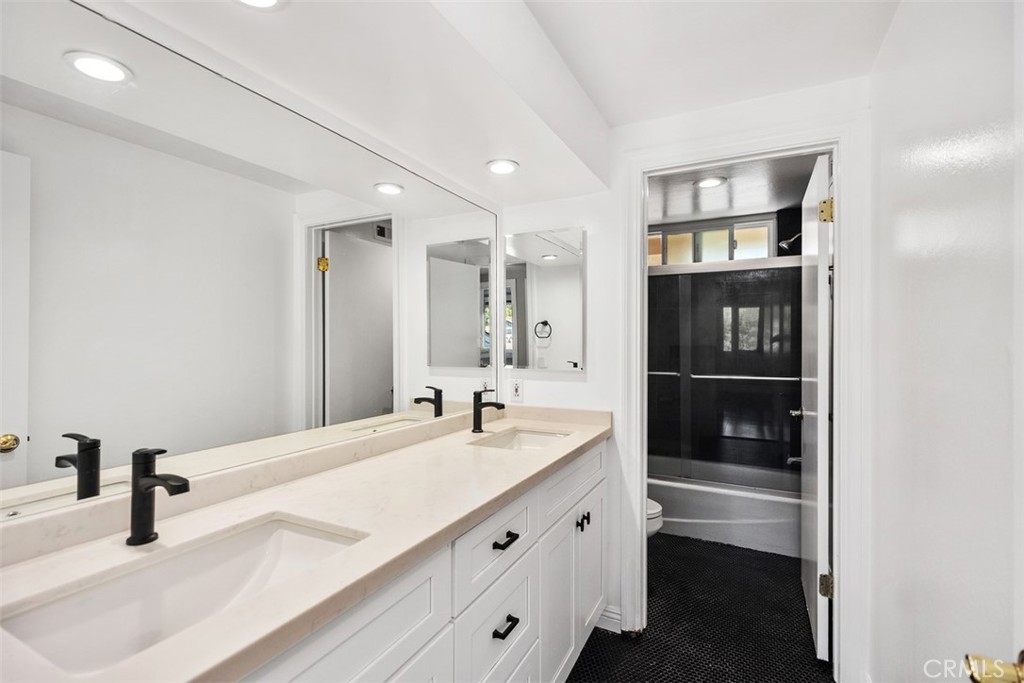 10 Rippling Streme Irvine, CA 92603 - Photo 25 of 31 a bathroom with a sink double vanity and a shower