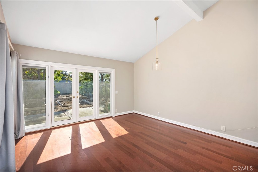 10 Rippling Streme Irvine, CA 92603 - Photo 4 of 31 a view of an empty room with wooden floor and a window