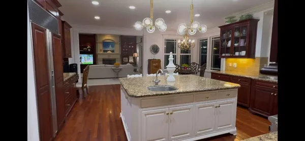 a living room with furniture a fireplace and a window