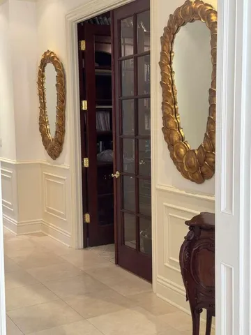 a dining room with furniture and a bookshelf