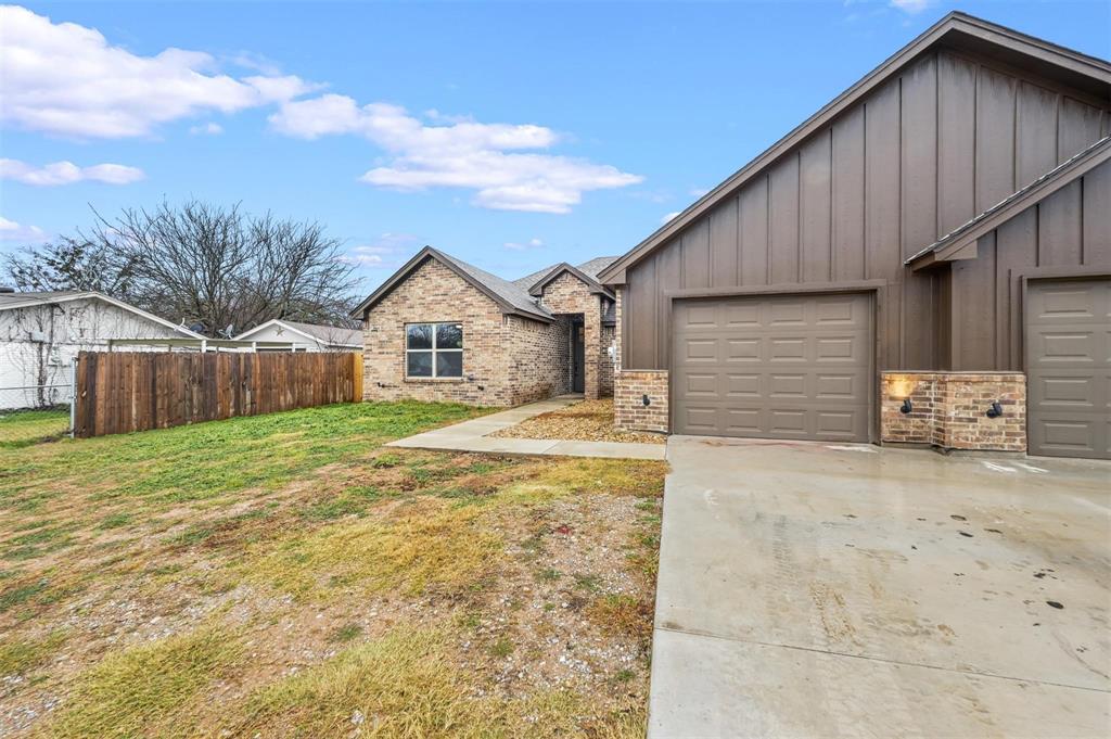228 St Charles Drive, Unit B Springtown, TX 76082 - Photo 18 of 20 a view of a house with wooden fence