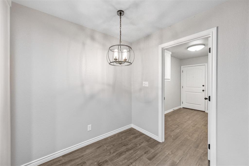 228 St Charles Drive, Unit B Springtown, TX 76082 - Photo 7 of 20 a view of a hallway with wooden floor