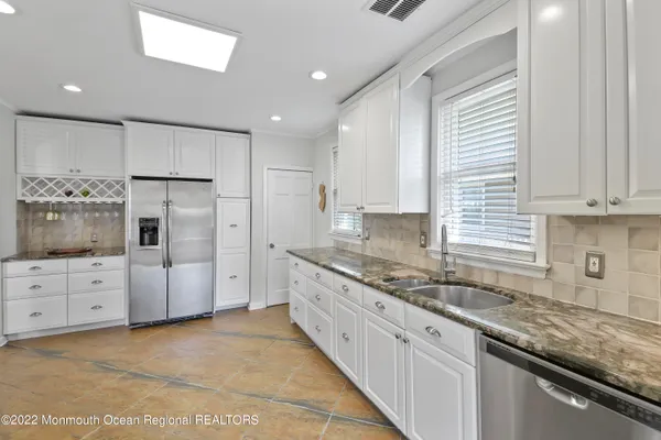 a large kitchen with cabinets