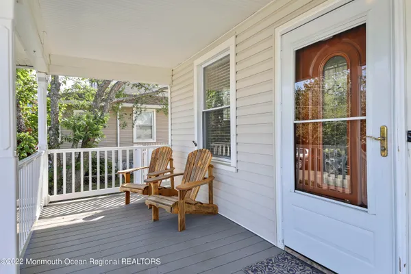 a view of a chair and table in the balcony