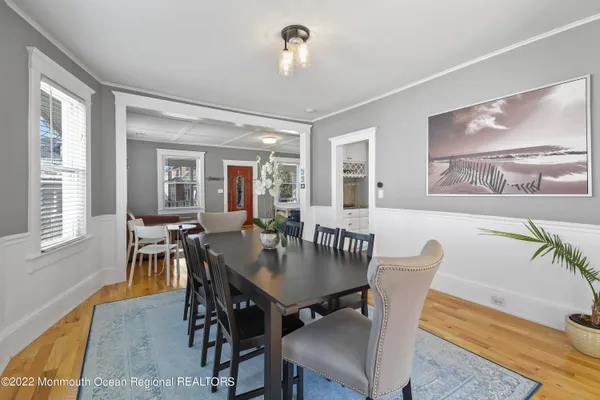 a view of a dining room with furniture and a window