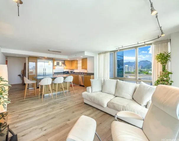 a living room with furniture and a large window