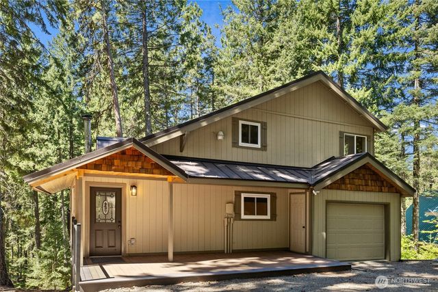 a front view of a house with yard