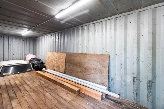 a bathroom with a granite countertop sink mirror vanity and toilet