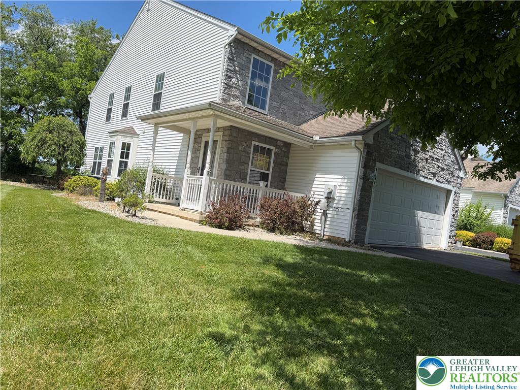 4157 Walter Road Bethlehem, PA 18020 - Photo 4 of 36 A classic facade combining white siding and grey stone accents creates appealing curb appeal.