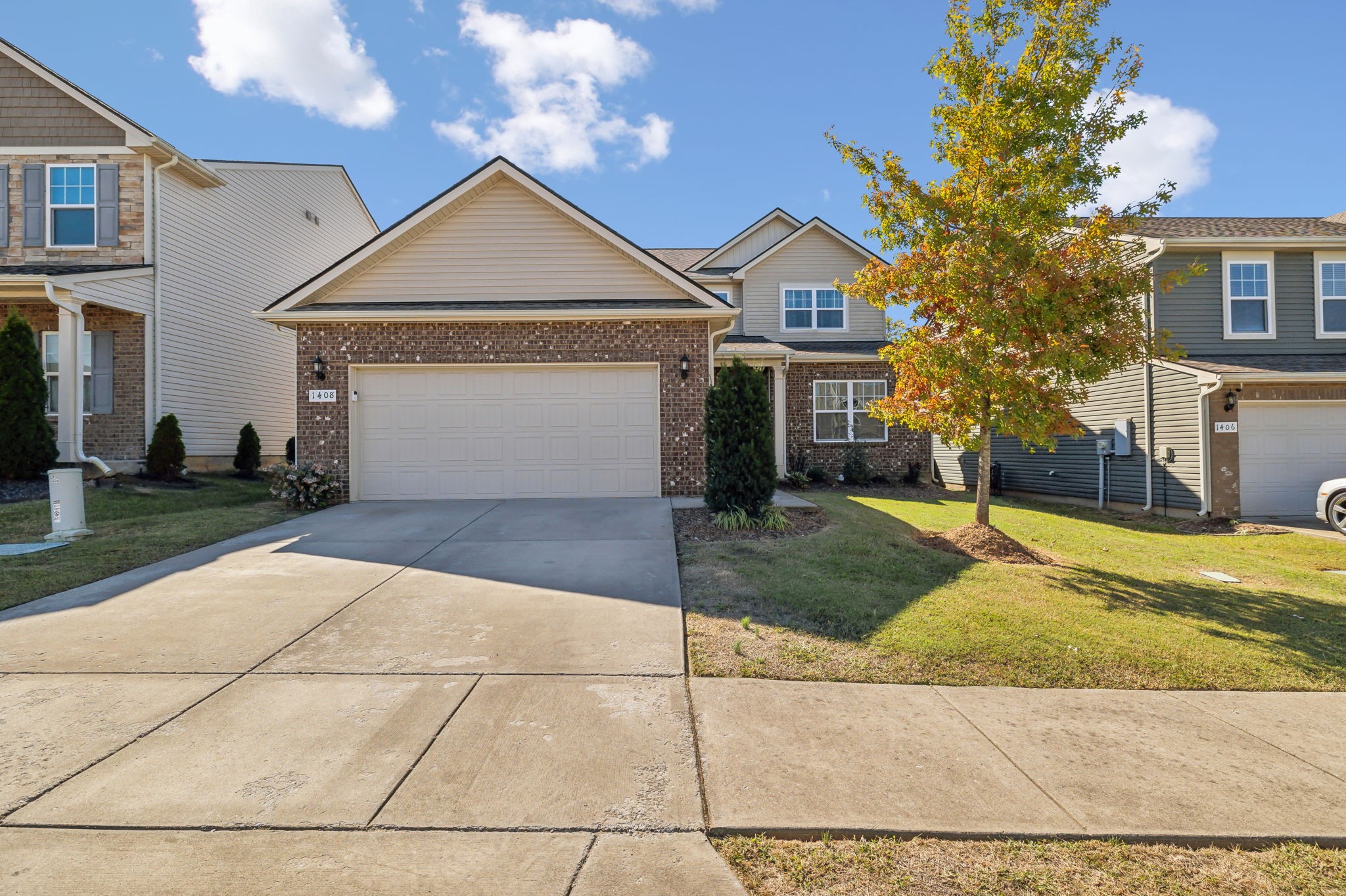 1408 Old Stone Road Lebanon, TN 37087 - Photo 1 of 31 a front view of a house with a yard and garage