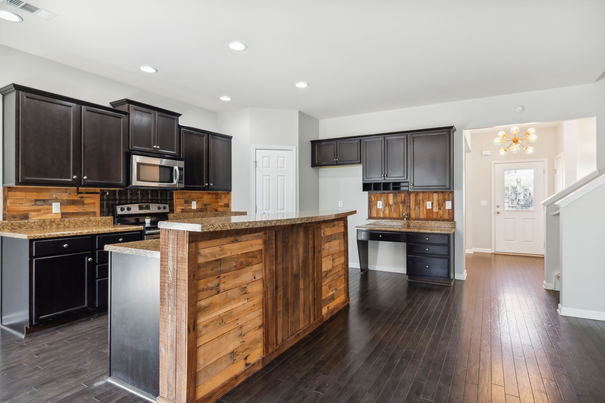 1408 Old Stone Road Lebanon, TN 37087 - Photo 11 of 31 a kitchen with granite countertop wooden floors stainless steel appliances a sink and a window