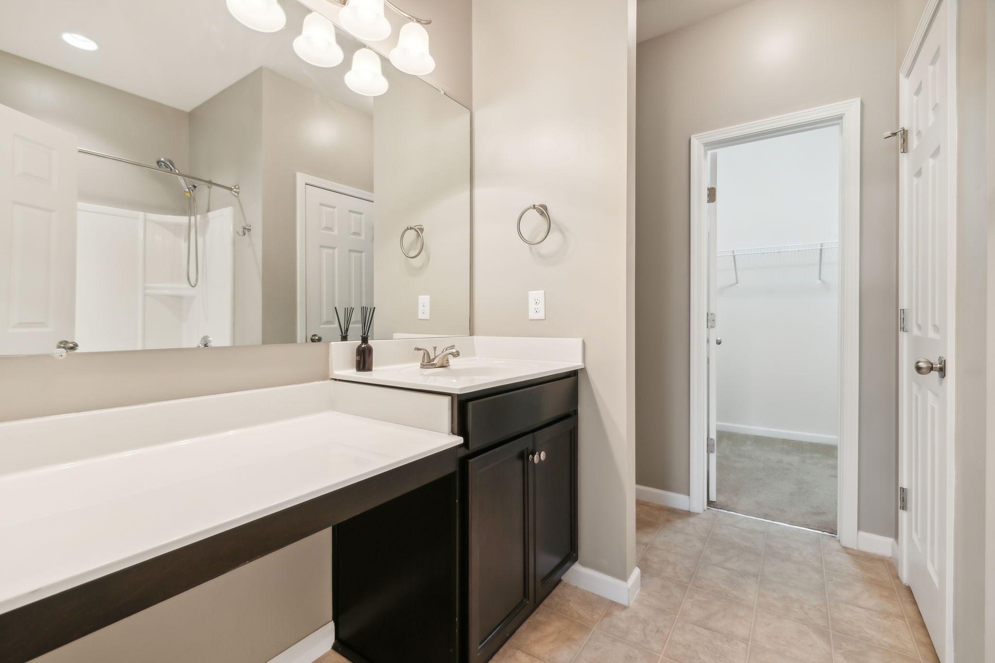 1408 Old Stone Road Lebanon, TN 37087 - Photo 14 of 31 a bathroom with a sink a large mirror and a shower