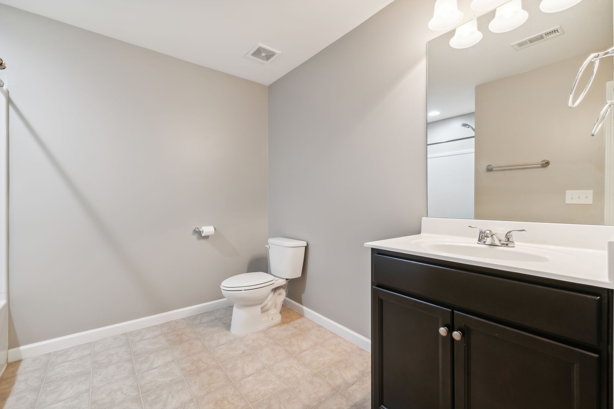 1408 Old Stone Road Lebanon, TN 37087 - Photo 17 of 31 a bathroom with a sink a toilet and a mirror