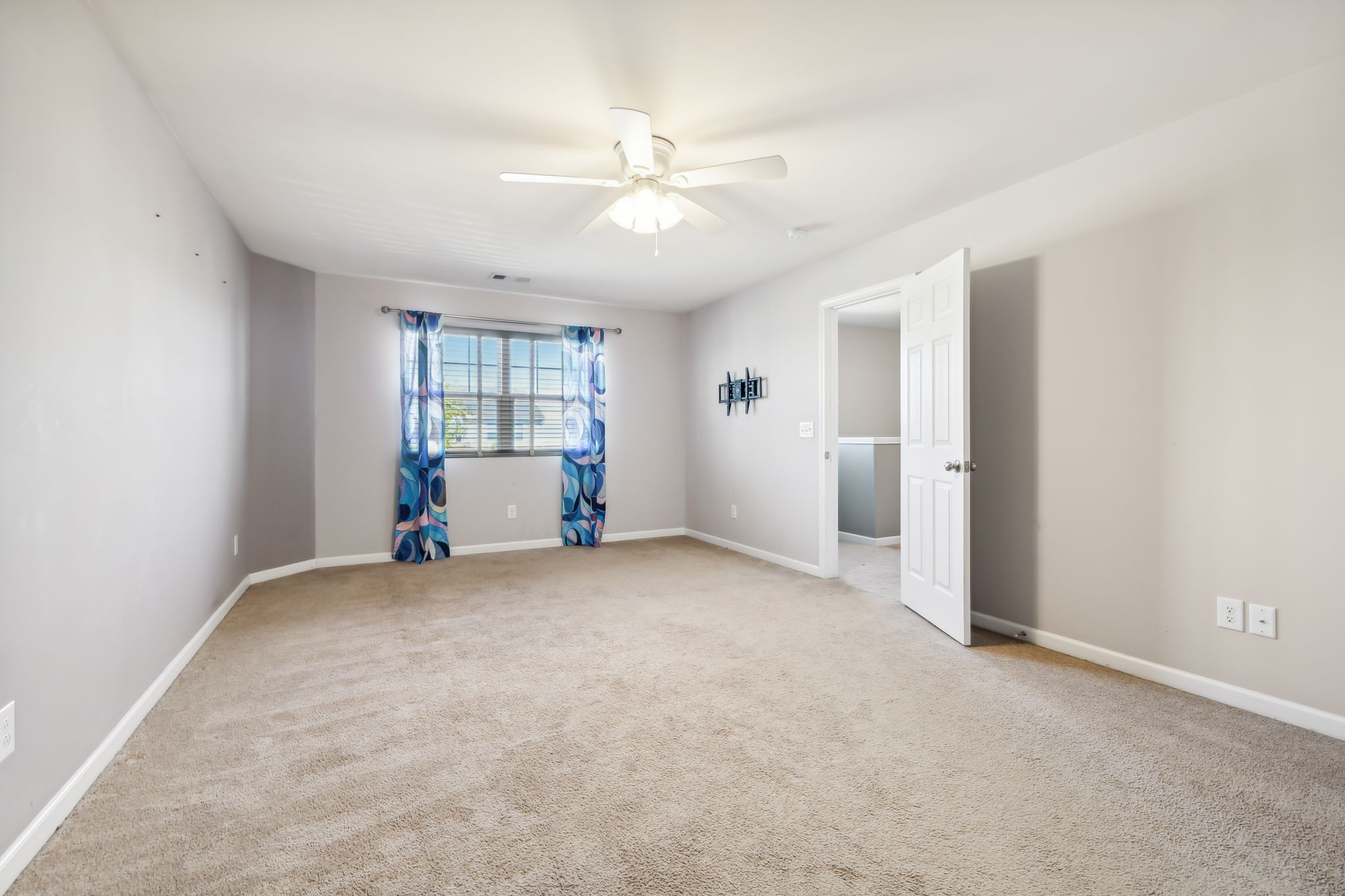 1408 Old Stone Road Lebanon, TN 37087 - Photo 23 of 31 an empty room with windows and ceiling fan