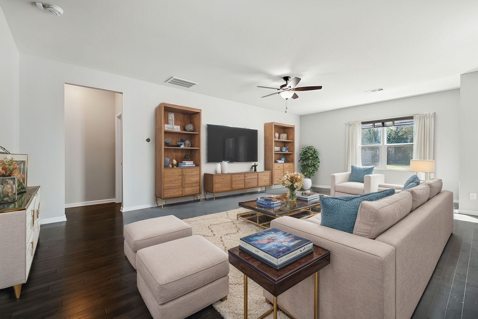 1408 Old Stone Road Lebanon, TN 37087 - Photo 6 of 31 a living room with furniture a flat screen tv and wooden floor