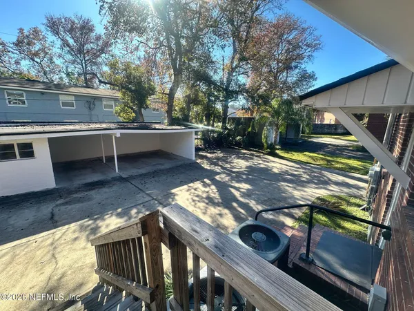 a view of a backyard with sitting area