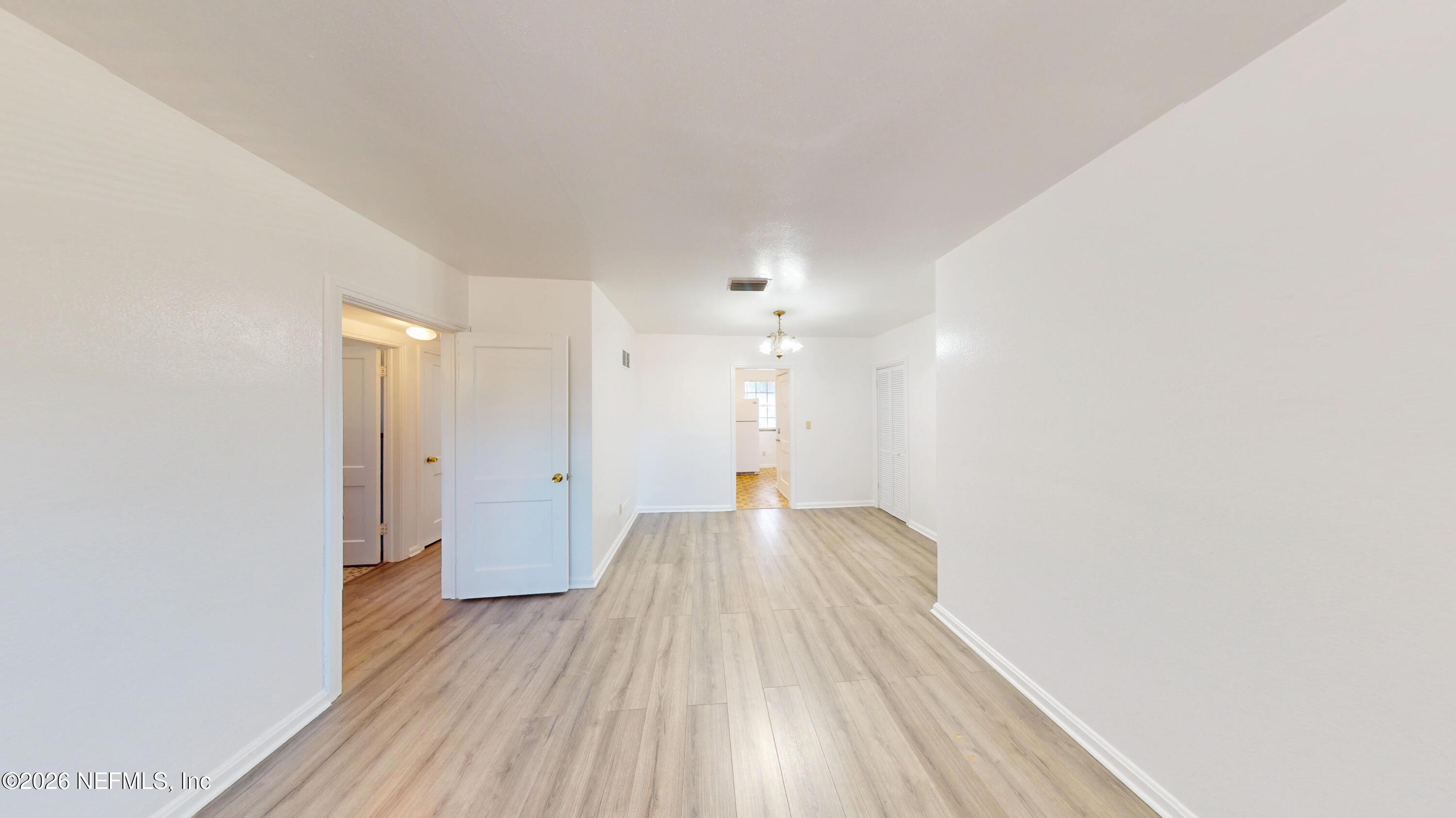 3126 Belden Circle, Unit 3 Jacksonville, FL 32207 - Photo 3 of 15 a view of a big room with wooden floor and windows