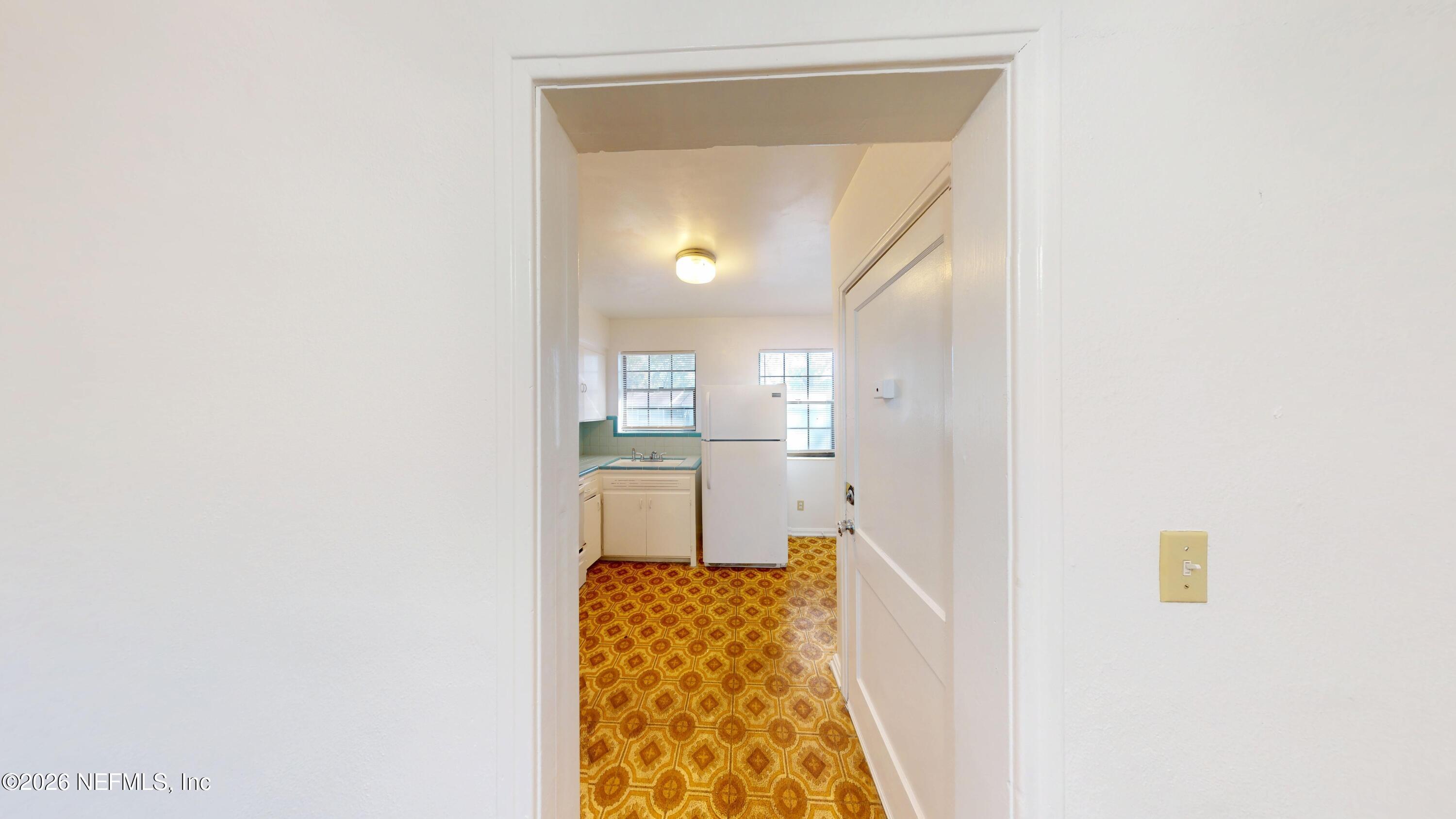 3126 Belden Circle, Unit 3 Jacksonville, FL 32207 - Photo 4 of 15 a bathroom with a sink and a mirror